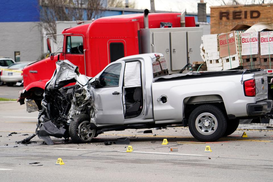 Officers comb a site for evidence after Roseville police fatally shot a man early Tuesday morning on Groesbeck Highway, April 26, 2022 between 12 Mile and Martin roads.