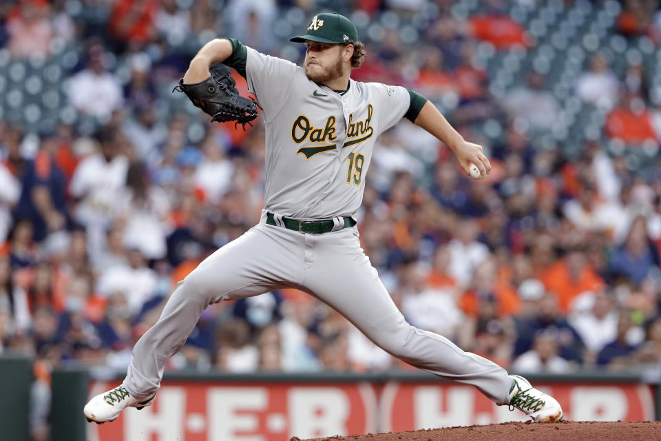 Oakland Athletics starting pitcher Cole Irvin winds up during the first inning of the team's baseball game against the Houston Astros on Thursday, April 8, 2021, in Houston. (AP Photo/Michael Wyke)