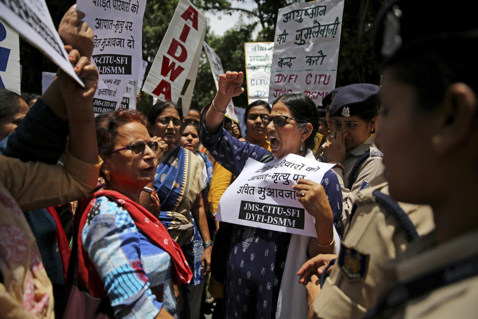 Left wing activists shout slogans as they protest against deaths of more than 100 children due to Encephalitis in the Indian state of Bihar, in New Delhi, India, Tuesday, June 18, 2019. (AP Photo/Altaf Qadri)