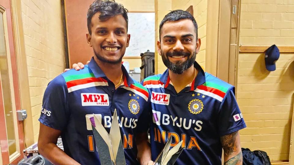 <div class="paragraphs"><p>T Natarajan poses with Virat Kohli after the T20 series triumph against Australia. </p></div>