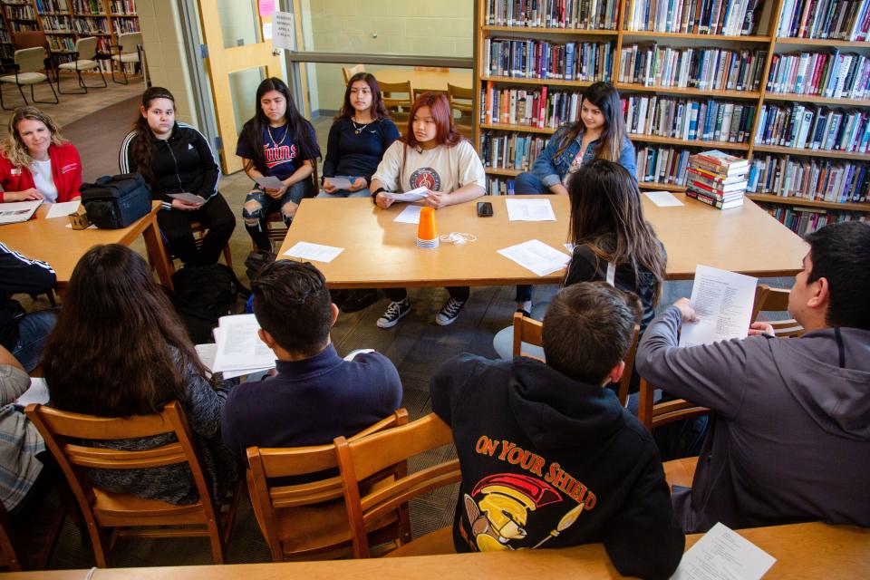 Beauna Thammathai, 16, center, leads a 4-H meeting at Storm Lake High School Monday, April 8, 2019.