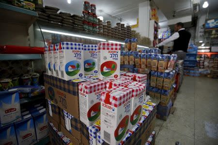 Cartons containing milk produced by Israeli food-maker Tnuva are seen at a supermarket in the West Bank city of Ramallah March 22, 2016. REUTERS/Mohamad Torokman