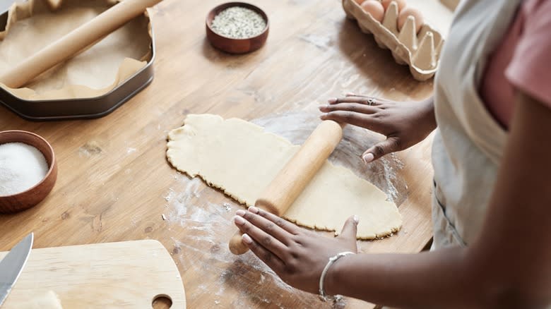 Person making pie pastry
