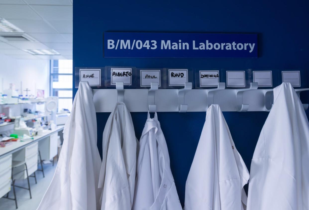 <span class="caption">Many scientists have had to hang up their lab coats and go home.</span> <span class="attribution"><a class="link " href="https://www.gettyimages.com/detail/photo/cancer-research-laboratory-row-of-lab-coats-royalty-free-image/544457023" rel="nofollow noopener" target="_blank" data-ylk="slk:Jonathan Pow/Cultura via Getty Images;elm:context_link;itc:0;sec:content-canvas">Jonathan Pow/Cultura via Getty Images</a></span>