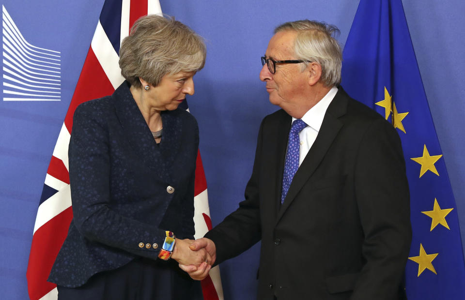 European Commission President Jean-Claude Juncker shakes hands with British Prime Minister Theresa May before their meeting at the European Commission headquarters in Brussels, Thursday, Feb. 7, 2019. (AP Photo/Francisco Seco)