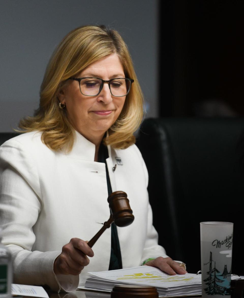 MSU Interim President Teresa Woodruff uses the gavel to kick off a board meeting, Friday, April 21, 2023, during the Michigan State University Board of Trustees meeting at the Hannah Administration Building.