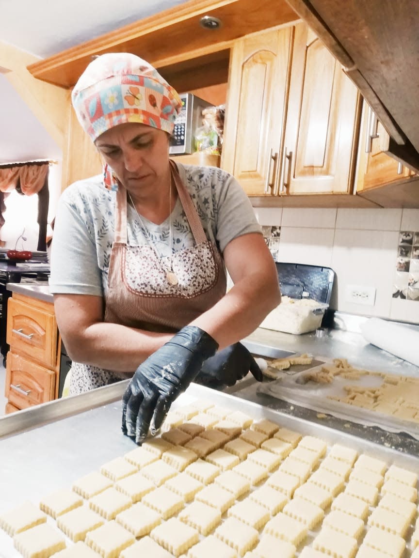 Gloria Quintero works at her bakery business in her kitchen in Granada, Colombia.