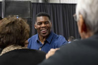 Republican candidate for U.S. Senate Herschel Walker greets supporters during a campaign stop at the Governors Gun Club in Kennesaw, Ga., on Monday, Dec. 5, 2022. (AP Photo/Ben Gray)