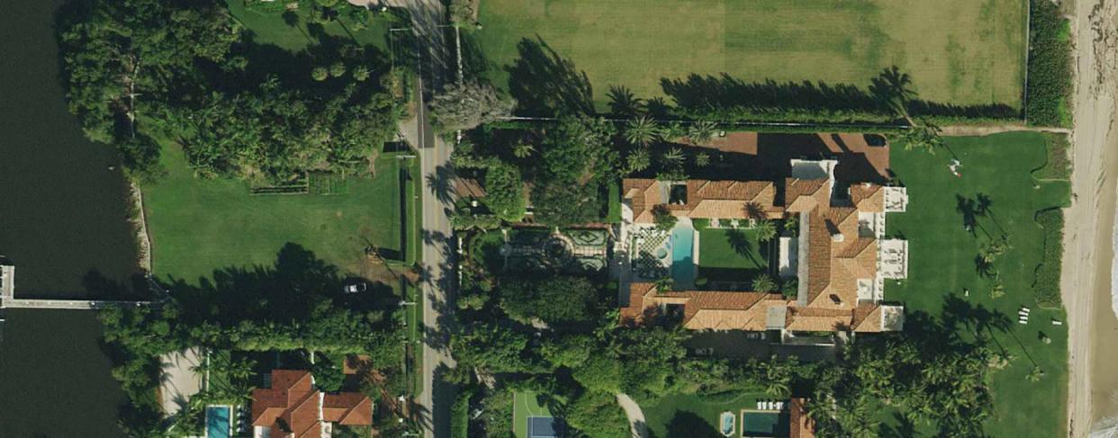 Viewed from above, a vacant lot, center left, was for years part of a Palm Beach ocean-to-lake estate that included the oceanfront mansion, center right, at 1295 S. Ocean Blvd. In 2019, the estate of the late banking heiress Terry Allen Kramer sold both properties to a company linked to hedge-fund billionaire Ken Griffin. Both properties are now part of Griffin's 27-acre estate.