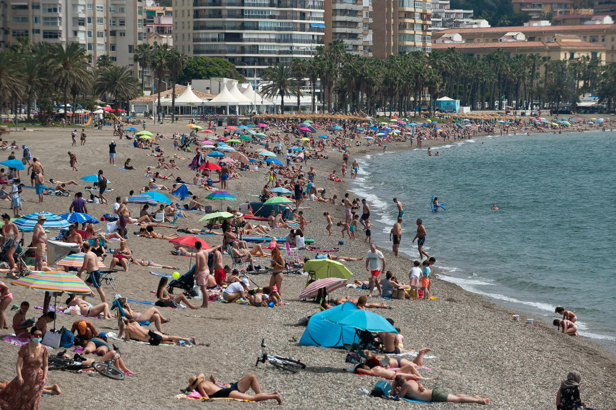  Bathers are seen sunbathing at Malagueta beach on a foggy day.
Spaniards live their first weekend without mobility restrictions and curfew since the end of state of alarm in the country due to stabilization of coronavirus disease. The increase of massive vaccinations have provoke an decrease of infections and outbreaks in Spain. (Photo by Jesus Merida / SOPA Images/Sipa USA) 