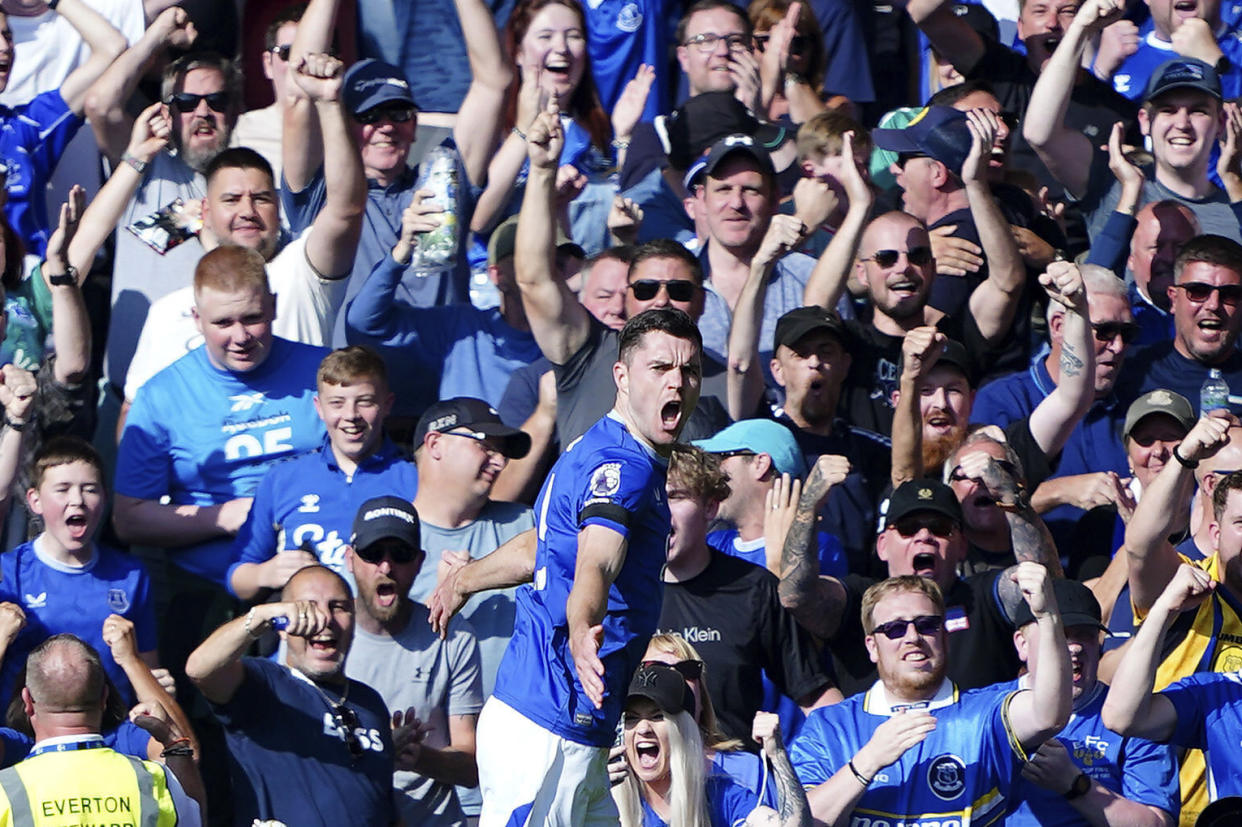 Everton's Michael Keane celebrates scoring during the English Premier League soccer match between Everton and Bournemouth at Goodison Park, Liverpool, England, Saturday Aug. 31, 2024. (Peter Byrne/PA via AP)