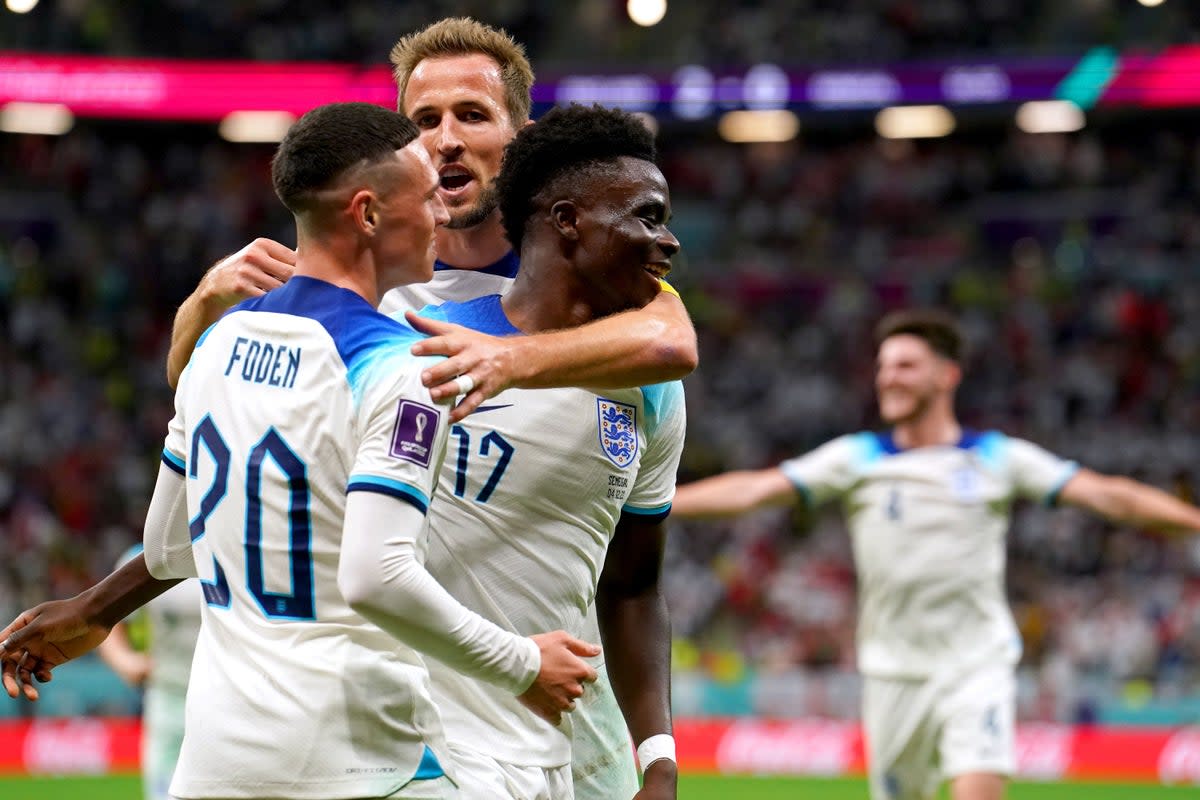 Harry Kane feels like a “proud older brother” to fellow England stars Bukayo Saka (right) and Phil Foden (left) (Martin Rickett/PA) (PA Wire)