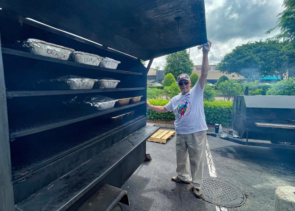 Volunteer Jim McDaniel is one of several grill masters at the annual Chicken and Rib Roast Fundraiser on May 5 at Belk, 11397 Parkside Drive.