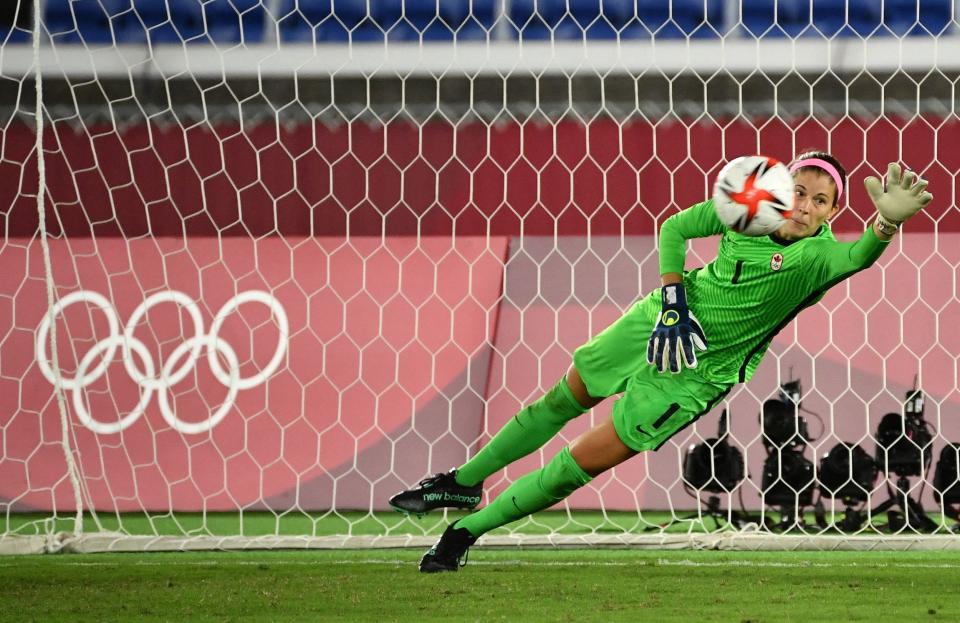 Canada's Steph Labbé lays out to save a penalty kick.