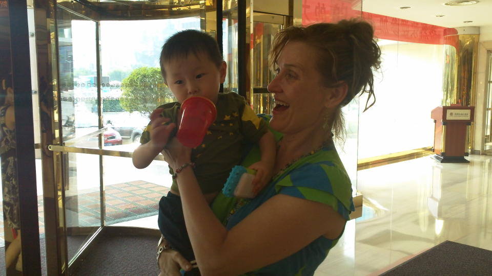 The picture was taken in August 2013 in Jinan, China about 30 minutes after we'd met.  His caregivers from the orphanage were just outside of the picture.  At this point, he thought I was just some nice lady with snacks.  It had not sunk in that we were forever.  He was three on adoption day. 