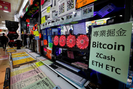 A cryptocurrency mining computer equipped with four cooling fans is seen on display at a computer mall in Hong Kong, China January 29, 2018. Picture taken January 29, 2018. REUTERS/Bobby Yip