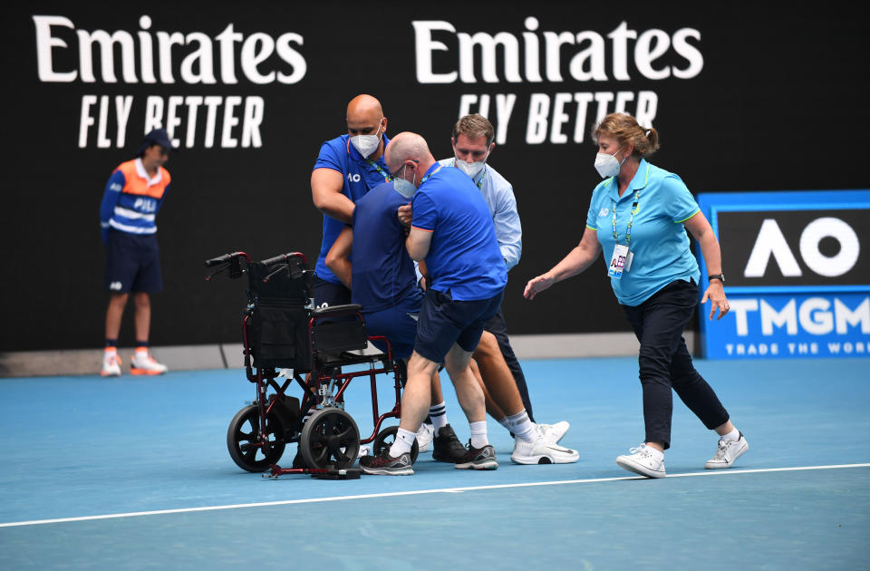 Jakub Mensik, pictured here being taken from the court in a wheelchair after the junior boy's final at the Australian Open.