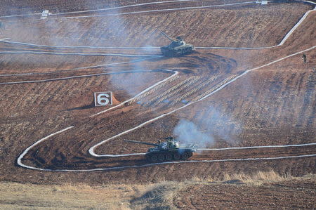 Tanks are seen during the Korean People's Army tank crews' competition at an unknown location. REUTERS/KCNA