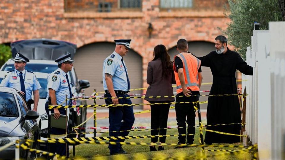 Police enter the Assyrian Christ The Good Shepherd Church with a clergyman in Wakeley, in Sydney, Australia, April 17, 2024.