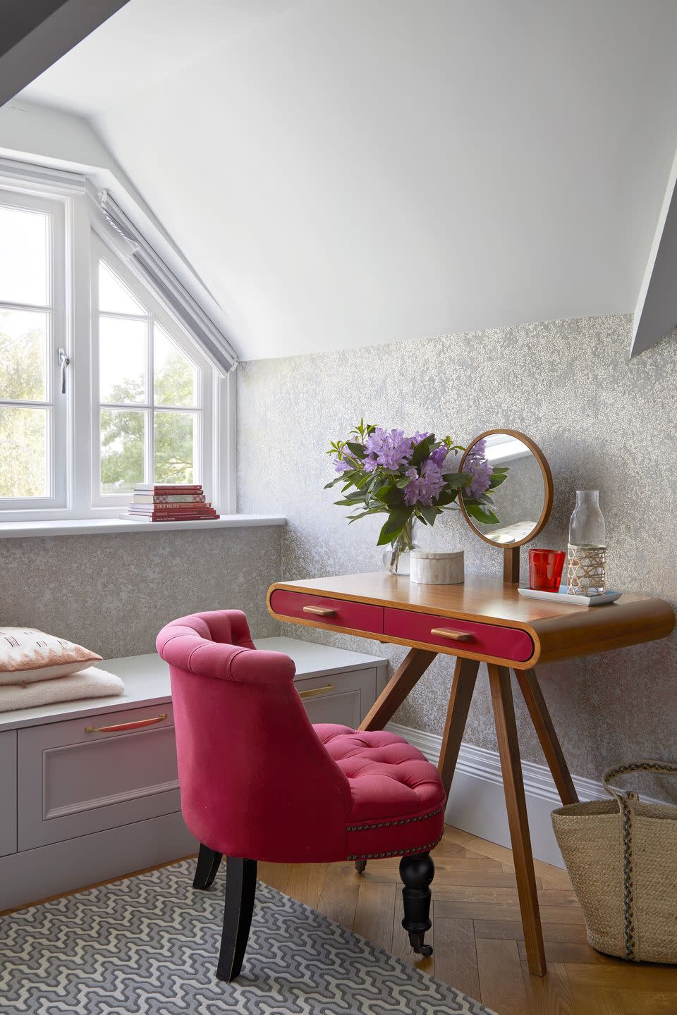 room with pink chair and desk