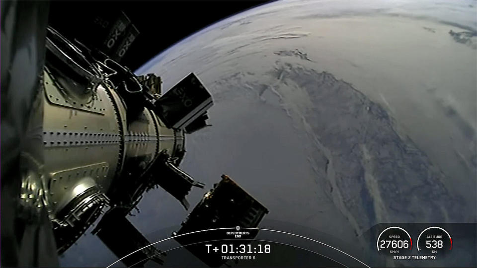 The Transporter 6 payloads were launched one at a time from a dispenser atop the Falcon 9 second stage. This view, showing a payload departing to lower right, came near the end of the deployment sequence as the rocket was passing over northern Canada. / Credit: SpaceX webcast