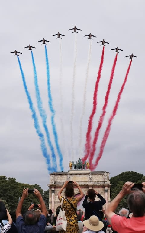 The Patrouille de France passes over the Arc de Triomphe du Carrousel  - Credit: Rex