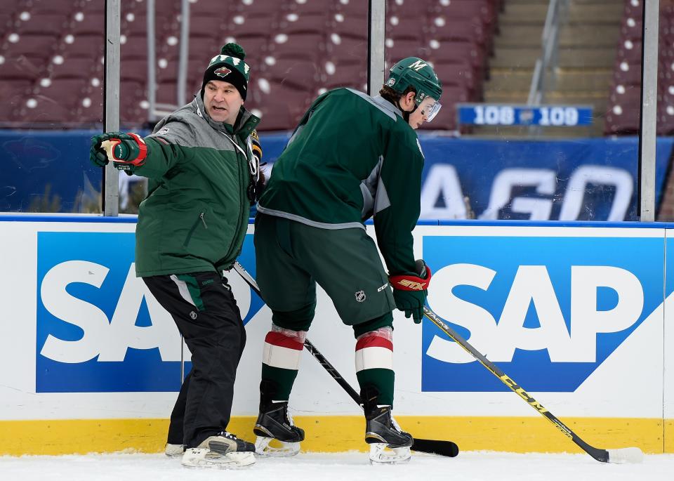 MINNEAPOLIS, MN - FEBRUARY 20: Interim head coach John Torchetti of the Minnesota Wild speaks to Charlie Coyle #3 during practice day at the 2016 Coors Light Stadium Series on February 20, 2016 at TCF Bank Stadium in Minneapolis, Minnesota. (Photo by Hannah Foslien/Getty Images)