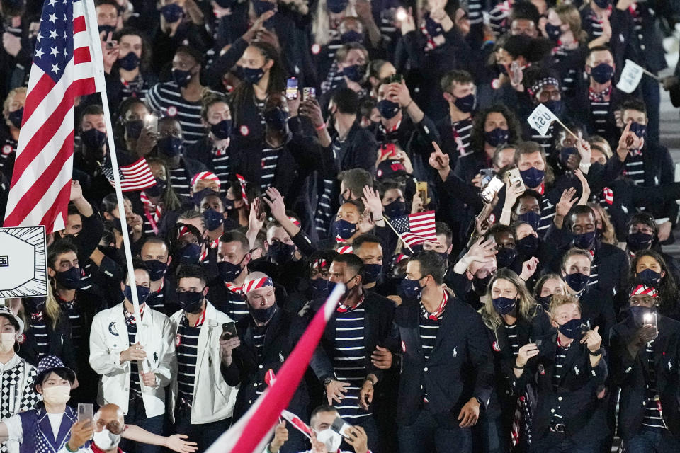 Athletes from the United States of America walk during the opening ceremony in the Olympic Stadium at the 2020 Summer Olympics, Friday, July 23, 2021, in Tokyo, Japan. (AP Photo/David J. Phillip)