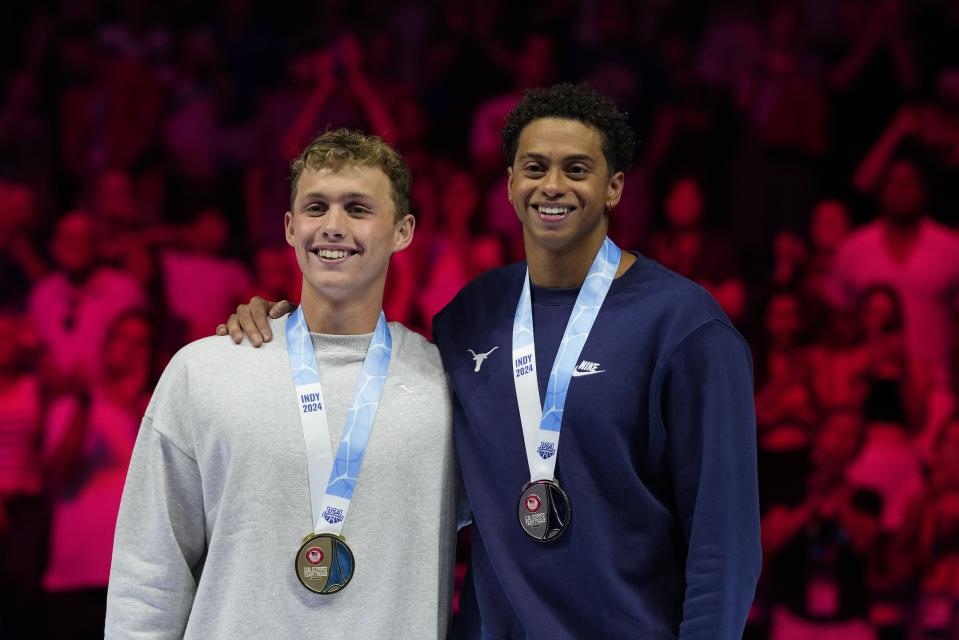 Shaine Casas and Carson Foster celebrate after the Men's 200 individual medley finals Friday, June 21, 2024, at the US Swimming Olympic Trials in Indianapolis. (AP Photo/Michael Conroy)