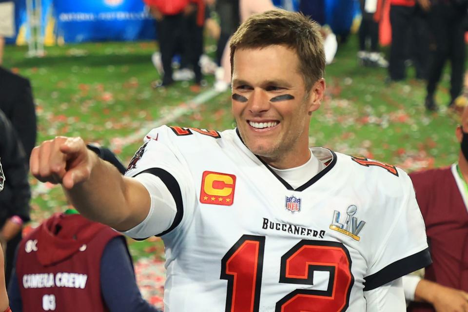 TAMPA, FLORIDA - FEBRUARY 07: Tom Brady #12 of the Tampa Bay Buccaneers celebrates after defeating the Kansas City Chiefs in Super Bowl LV at Raymond James Stadium on February 07, 2021 in Tampa, Florida. The Buccaneers defeated the Chiefs 31-9. (Photo by Mike Ehrmann/Getty Images)