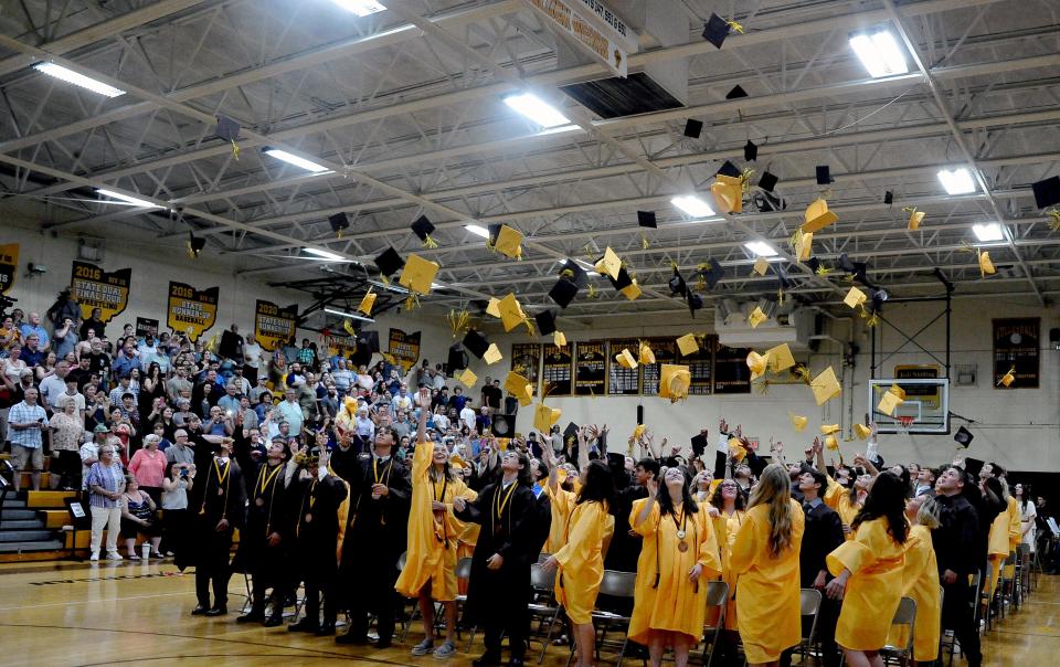 Waynedale High School graduates throw their caps in the air after their ceremony on Saturday, May 21. Waynedale High School Principal Richard Roth said this year's graduation was the first in the past two years to not have a question of whether or not it would be cancelled.