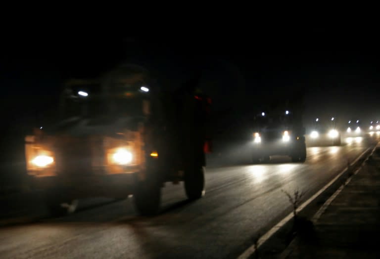 Turkish troop reinforcements travel south through the Syrian rebel bastion of Idlib on September 25, 2018 to provide the troop numbers required to patrol a buffer zone between the rebels and government forces agreed by Ankara and Moscow last week