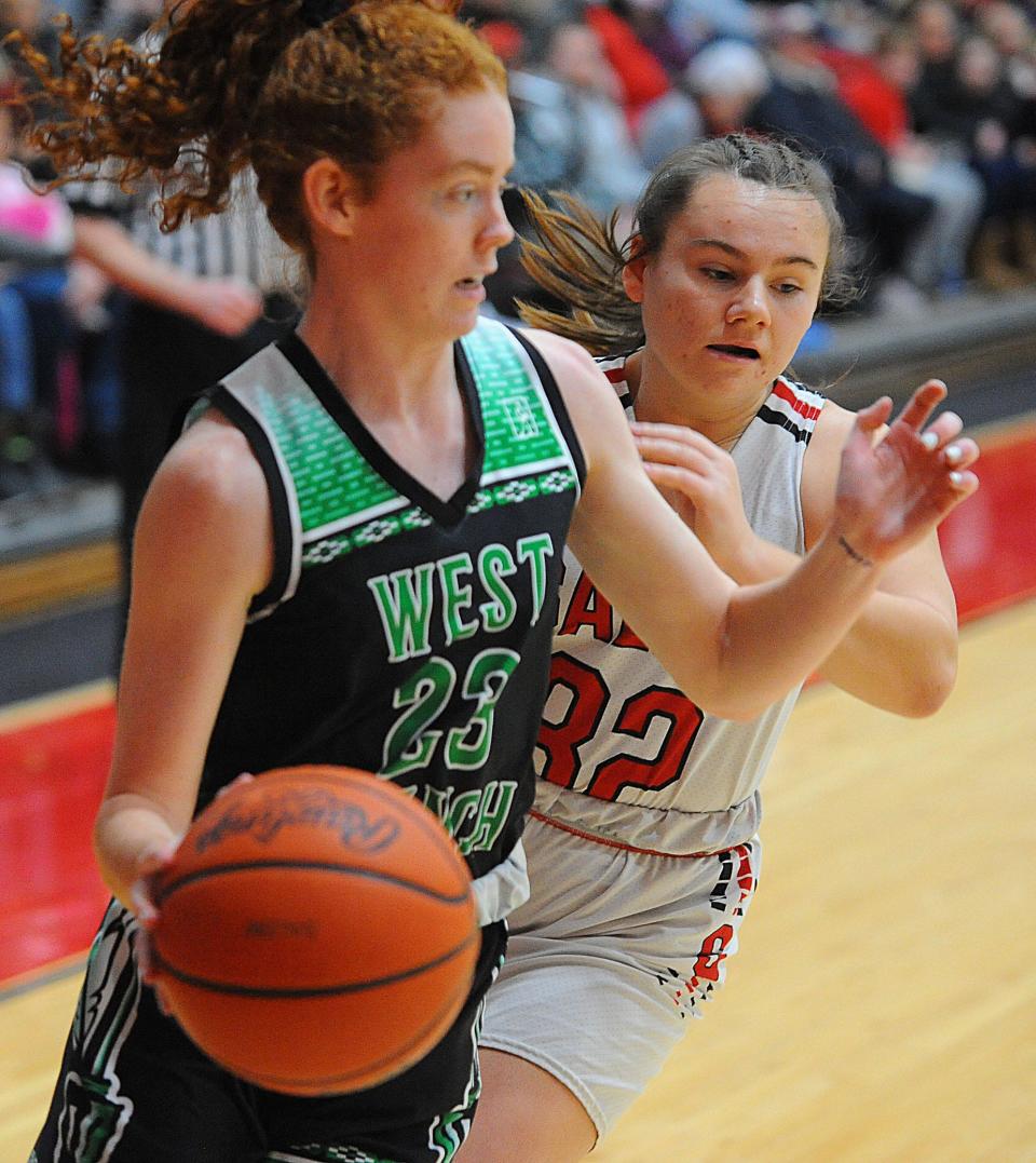 West Branch's Anna Lippiatt is defended by Salem's Krista Barley in an Eastern Buckeye Conference game Saturday, January 22, 2022 at Salem High School.