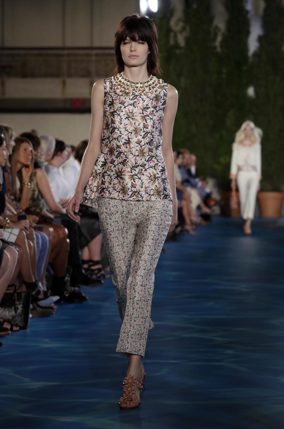 The Tory Burch Spring 2014 collection is modeled during Fashion Week in New York, Tuesday, Sept. 10, 2013. (AP Photo/Richard Drew)