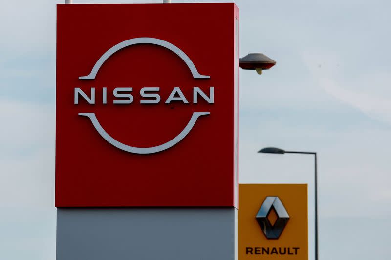 The logos of car manufacturers Renault and Nissan are seen in front of dealerships of the companies in Le Coteau