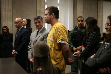 Former Chicago police Officer Jason Van Dyke (C) stands during his sentencing hearing at the Leighton Criminal Court Building in Chicago, Illinois, U.S., Janauary 18, 2019 Antonio Perez/Chicago Tribune/Pool via REUTERS