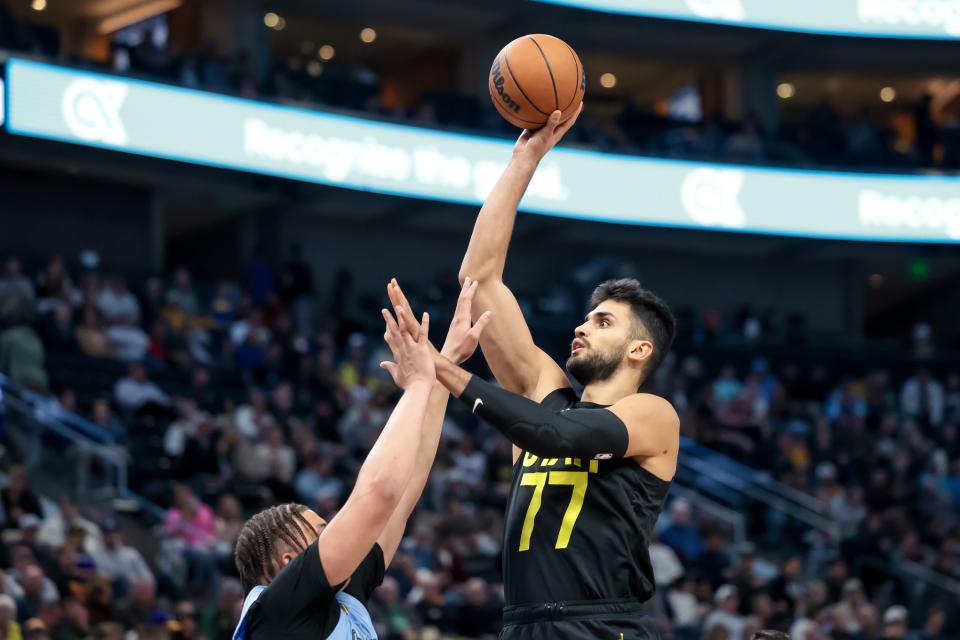 Utah Jazz center <a class="link " href="https://sports.yahoo.com/nba/players/6511" data-i13n="sec:content-canvas;subsec:anchor_text;elm:context_link" data-ylk="slk:Omer Yurtseven;sec:content-canvas;subsec:anchor_text;elm:context_link;itc:0">Omer Yurtseven</a> (77) shoots over Memphis Grizzlies forward Kenneth Lofton Jr. (6) during the game at the Delta Center in Salt Lake City on Wednesday, Nov. 1, 2023. | Spenser Heaps, Deseret News