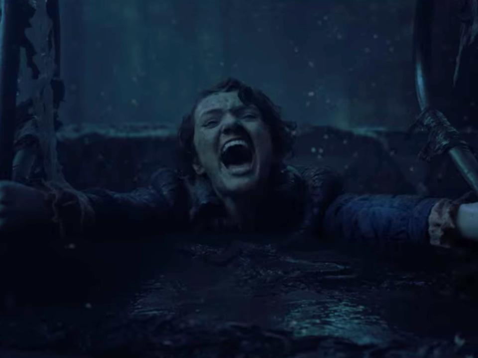 barb in stranger things, getting pulled down. into an empty pool in the upside down and screaming as she holds on to the handles