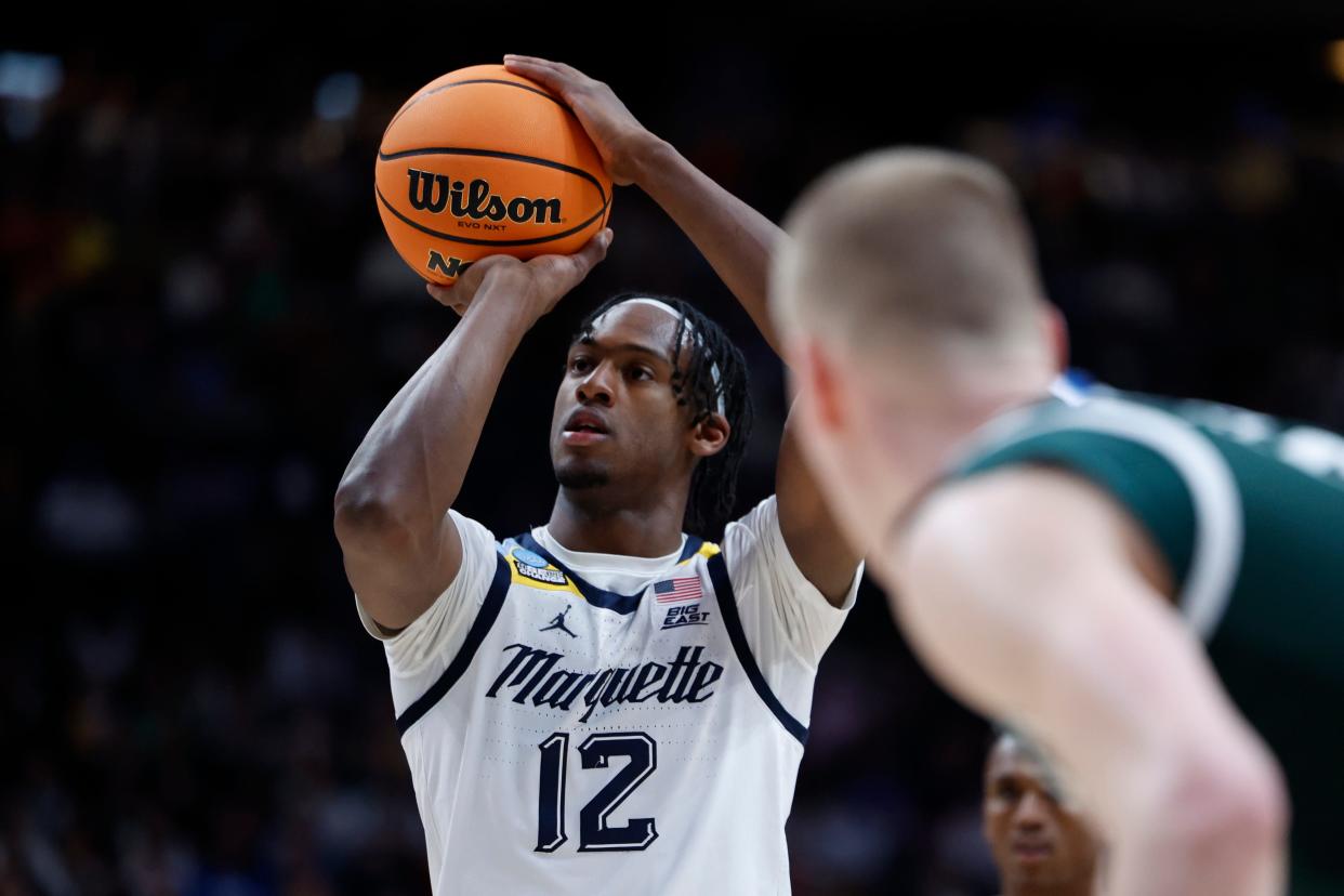 Marquette forward Olivier-Maxence Prosper shoots against Michigan State.