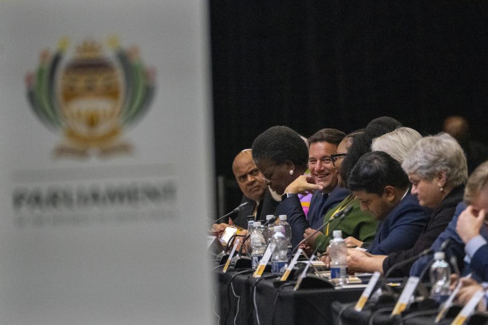 Democratic Alliance leader John Steenhuisen smiles at the end of the swearing in ceremony for members of parliament Cape Town, South Africa, Friday, June 14, 2024. Lawmakers are due to elect a president later on Friday and the ANC and DA together have a majority of lawmakers that would see Cyril Ramaphosa return for a second term. (AP Photo/Jerome Delay)