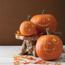 <p>Nothing sinister here! Carve a variety of funny and happy faces on your jack-o-lanterns this Halloween for a look that will still wow your neighbors.</p><p><em><a href="https://www.womansday.com/home/crafts-projects/a28580830/groovy-gourds/" rel="nofollow noopener" target="_blank" data-ylk="slk:Get the Groovy Gourds tutorial.;elm:context_link;itc:0;sec:content-canvas" class="link "><strong>Get the Groovy Gourds tutorial.</strong></a></em></p>