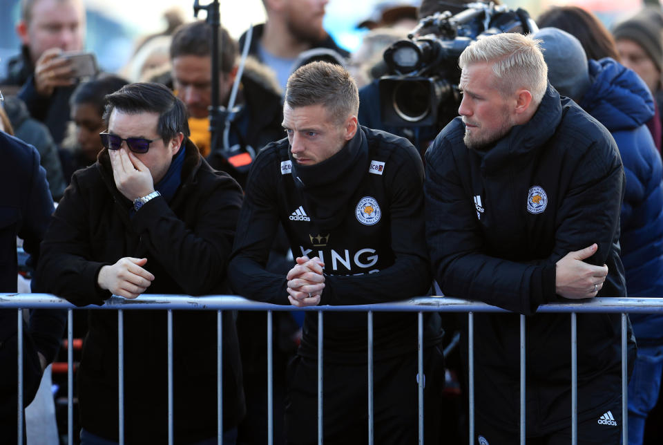 <p>Aiyawatt Srivaddhanaprabha, Jamie Vardy and goalkeeper Kasper Schmeichel pay tribute to club chairman Vichai Srivaddhanaprabha. Mike Egerton/PA Wire </p>