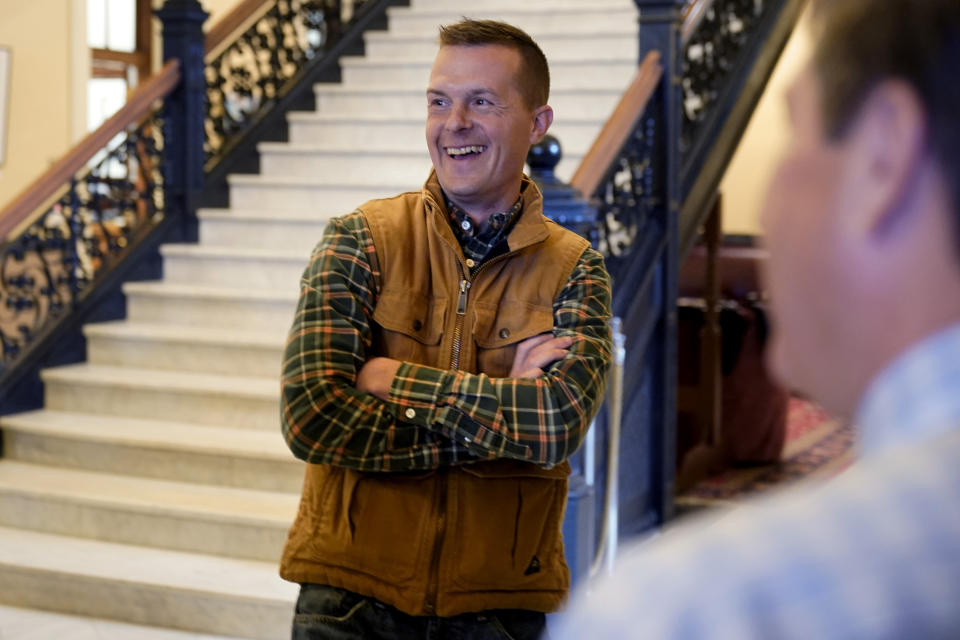 Rep. Jared Golden, D-Maine, speaks with supporters, Tuesday, Nov. 1, 2022, at the State House in Augusta, Maine. Golden, who is seeking reelection, is being challenged by Republican Bruce Poliquin. (AP Photo/Robert F. Bukaty)