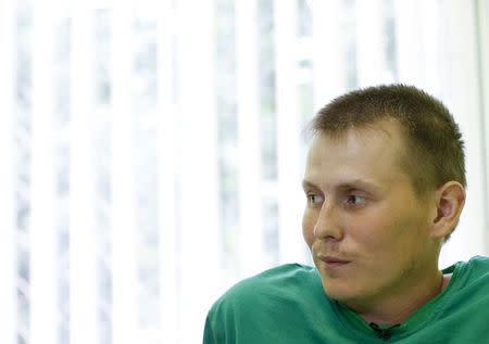 A man, who according to Ukraine's state security service (SBU) is named Alexander Alexandrov and is one of two Russian servicemen recently detained by Ukrainian forces, speaks during an interview with Reuters at a hospital in Kiev, Ukraine, May 28, 2015. REUTERS/Valentyn Ogirenko