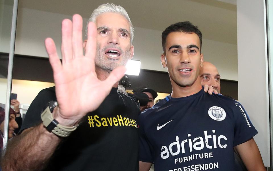 Craig Foster and Hakeem Al-Araibi at Melbourne Airport on Tuesday - 2019 Getty Images