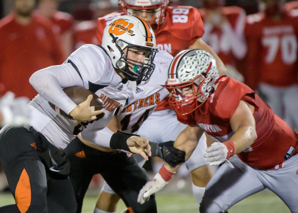 Washington quarterback Tyler Humphrey looks for room to run through the Morton defense in the second half of their Week 9 football game Friday, Oct. 20, 2023 in Morton.