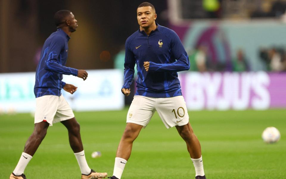 France's Kylian Mbappe during the warm up before the match - REUTERS