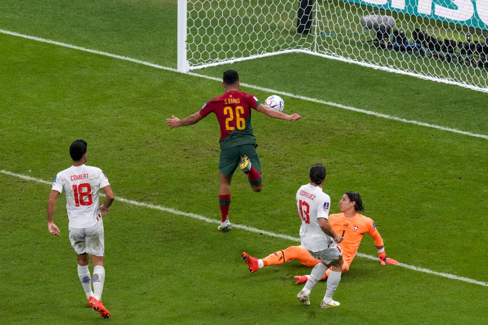 Portugal's Goncalo Ramos scores his side's 5th goal during the World Cup round of 16 soccer match between Portugal and Switzerland, at the Lusail Stadium in Lusail, Qatar, Tuesday, Dec. 6, 2022. (AP Photo/Frank Augstein)