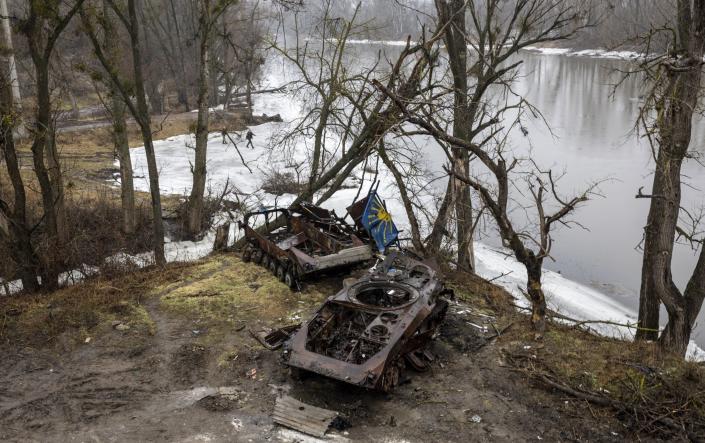 Destroyed armored vehicles sit on the bank of the Siverskiy-Donets river on February 27, 2023 in Bogorodychne, Ukraine. - John Moore/Getty Images Europe