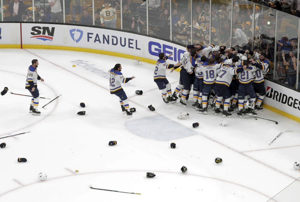 The St. Louis Blues celebrate their win over the Boston Bruins in Game 7 of the NHL hockey Stanley Cup Final, Wednesday, June 12, 2019, in Boston. (AP Photo/Charles Krupa)